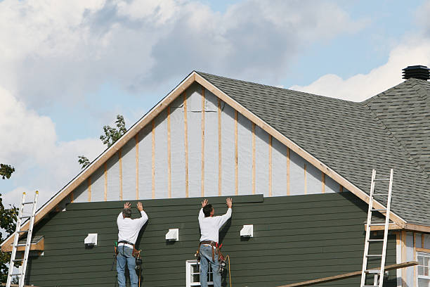 Professional Siding Installation technician working in Newtonville, MA